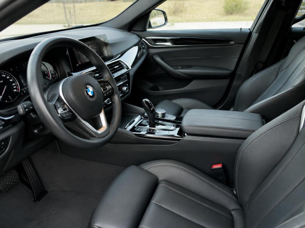 Clean car interior with dark leather seats